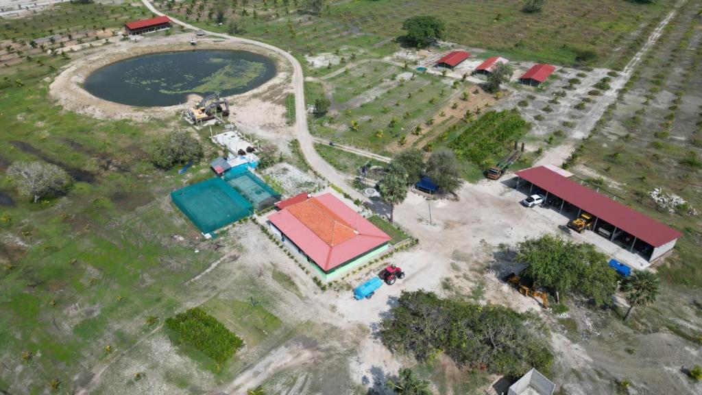 an overhead view of a park with a building at Farmhouse in Jaffna District 