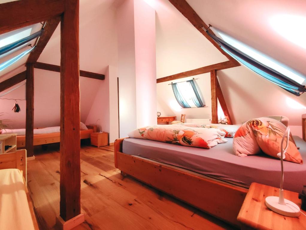 a bedroom with a bed in a attic at Charmantes Turmzimmer 