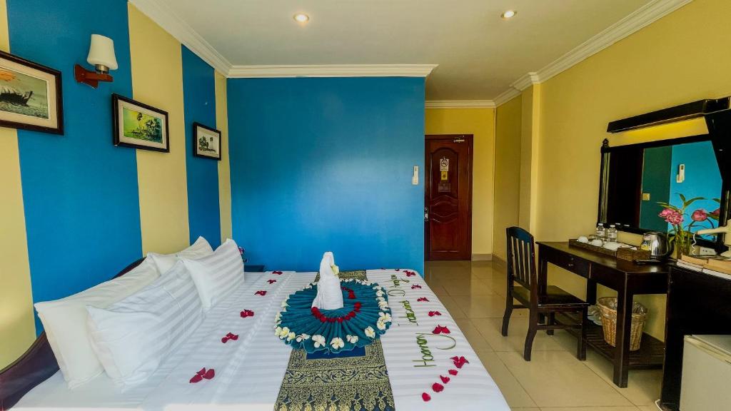 Postel nebo postele na pokoji v ubytování Harmony Indochine d'Angkor