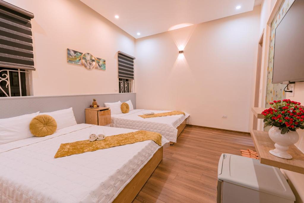 Postel nebo postele na pokoji v ubytování Golden Diamond Hotel