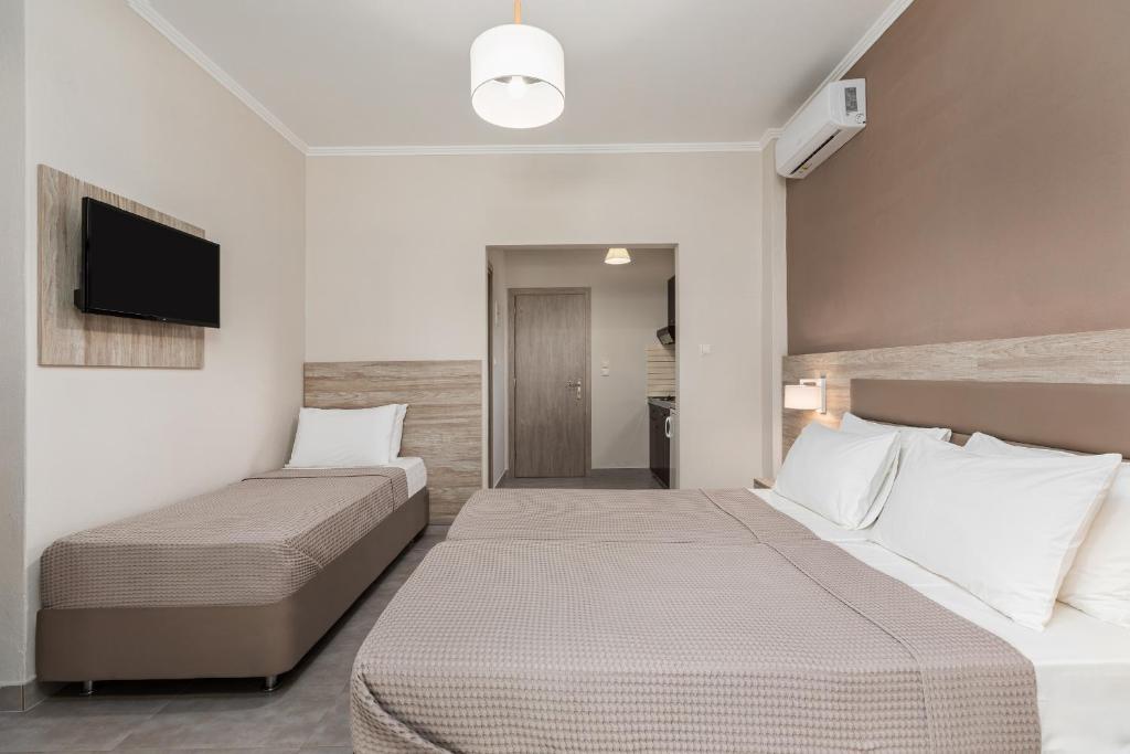 Postel nebo postele na pokoji v ubytování Hotel Grekas