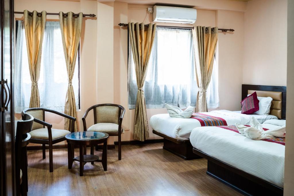 Postel nebo postele na pokoji v ubytování Hotel Namtso