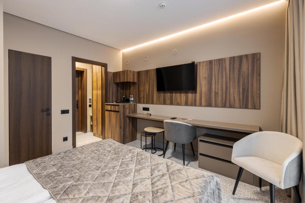 Postel nebo postele na pokoji v ubytování Hotel Ozero Vita
