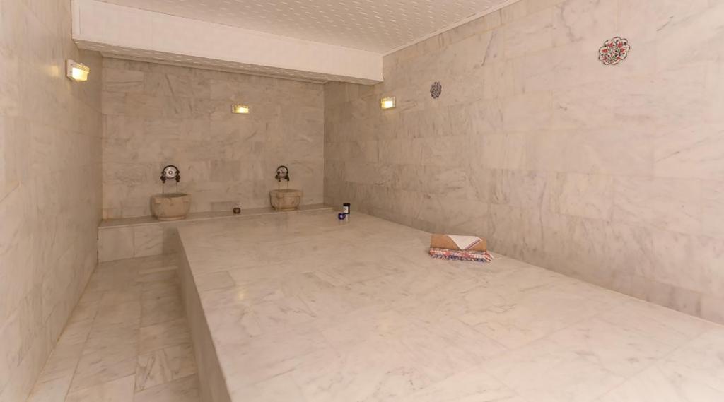 Postel nebo postele na pokoji v ubytování Ozlem Garden Hotel