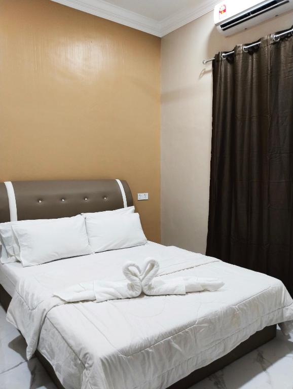 Postel nebo postele na pokoji v ubytování Villa Adeeva Homestay Langkawi