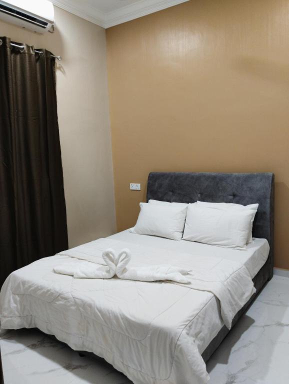 Postel nebo postele na pokoji v ubytování Villa Adeeva Homestay Langkawi