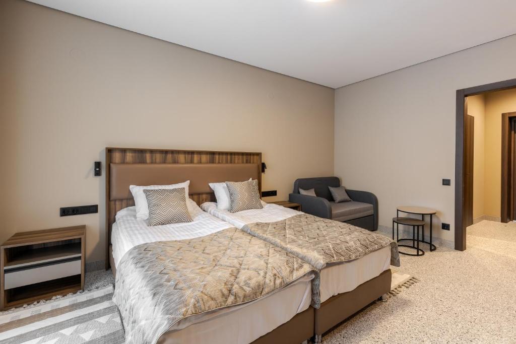 Postel nebo postele na pokoji v ubytování Hotel Ozero Vita