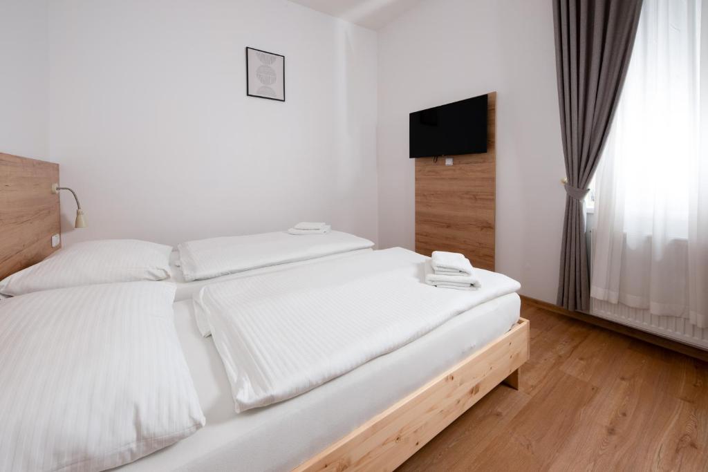 Postel nebo postele na pokoji v ubytování Penzion MOVEINN