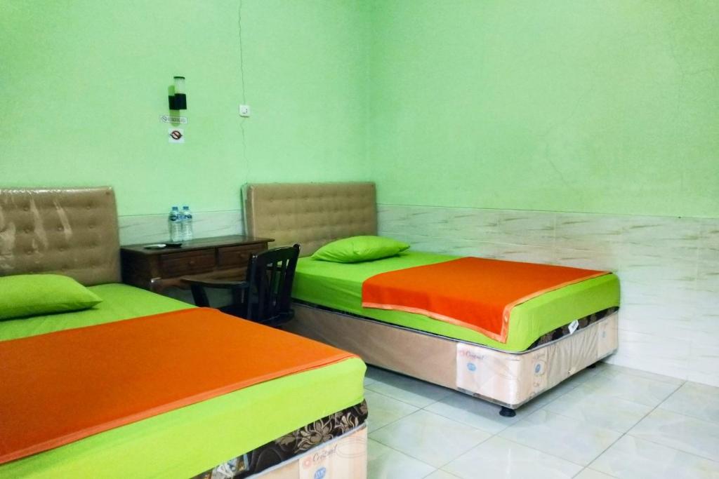 Postel nebo postele na pokoji v ubytování Hotel Antik
