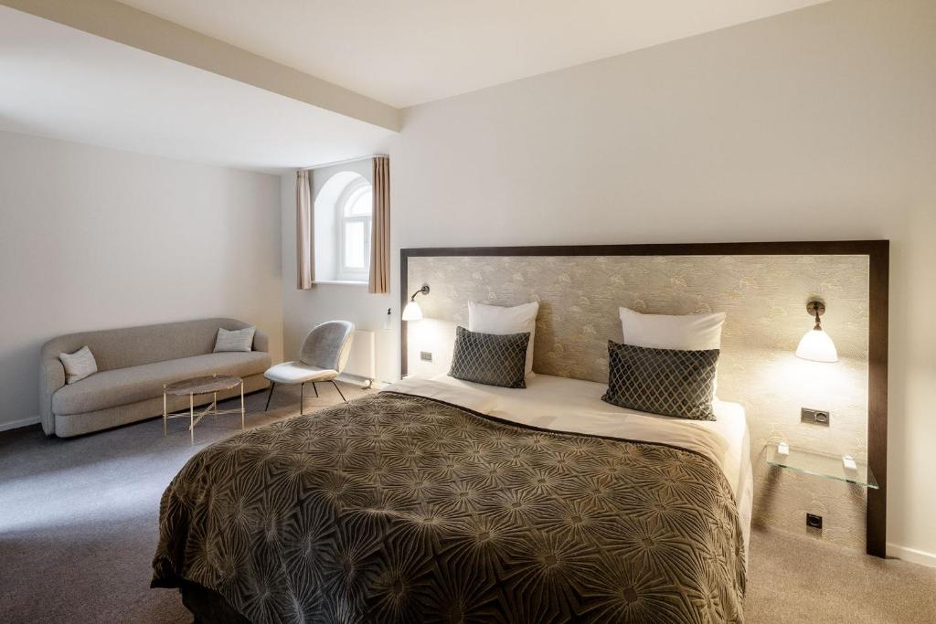 Postel nebo postele na pokoji v ubytování Ascot Hotel