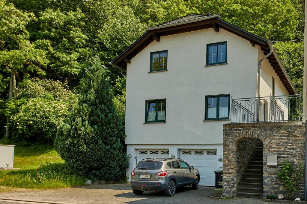 a car parked in front of a house at Haus an der Mosel in Bernkastel-Kues