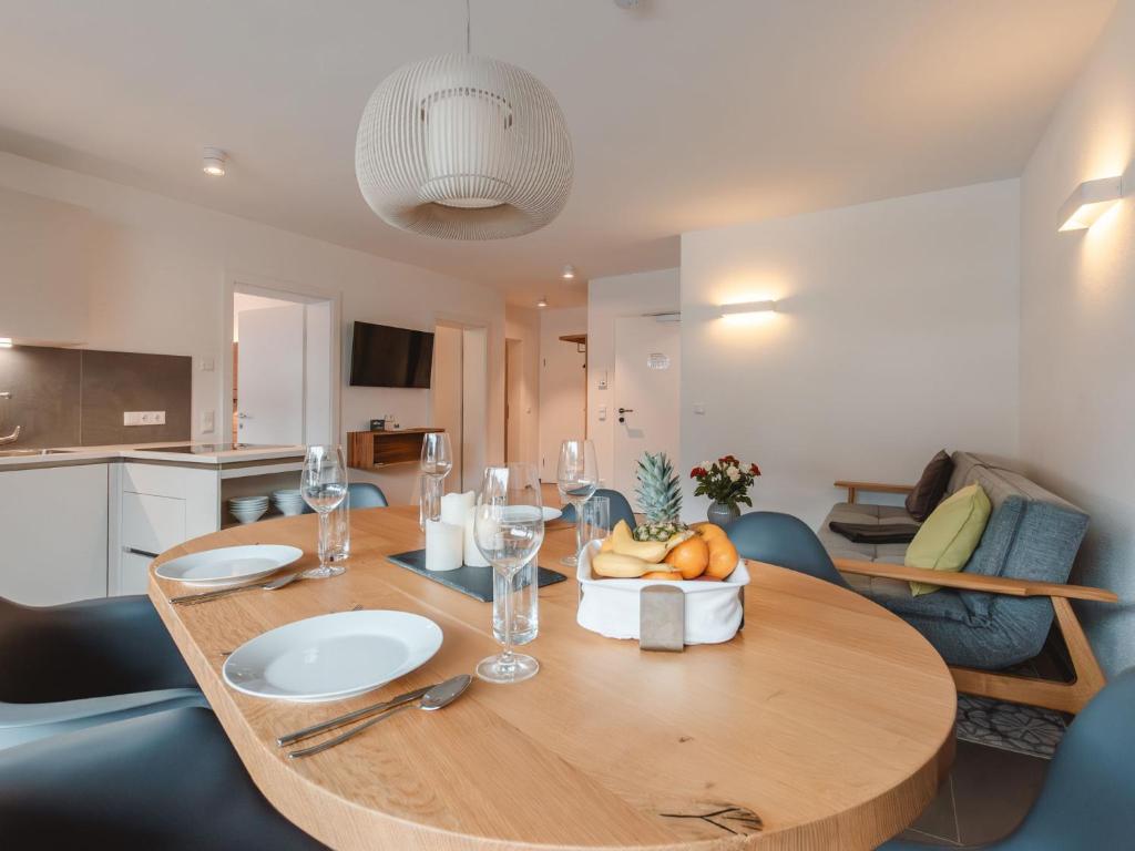 a dining room table with a bowl of fruit on it at Apartment Das Georgen- Schmitten by Interhome in Fürstau