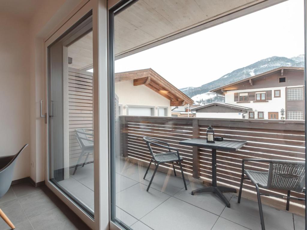 a balcony with a table and chairs on it at Apartment Das Georgen- Schmitten by Interhome in Fürstau