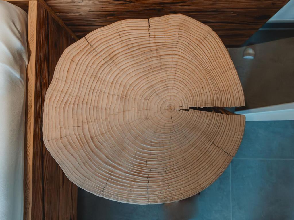 a large wooden hat hanging from a ceiling at Apartment Das Georgen- Schmitten by Interhome in Fürstau