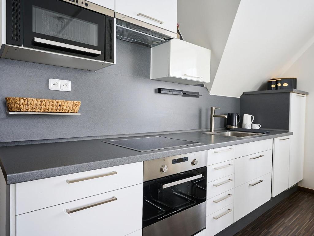 Kuchyň nebo kuchyňský kout v ubytování Apartment 566 by Interhome