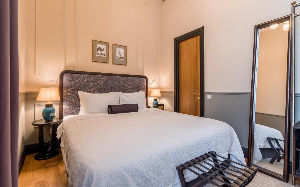 Postel nebo postele na pokoji v ubytování Communal Hotel Kutaisi