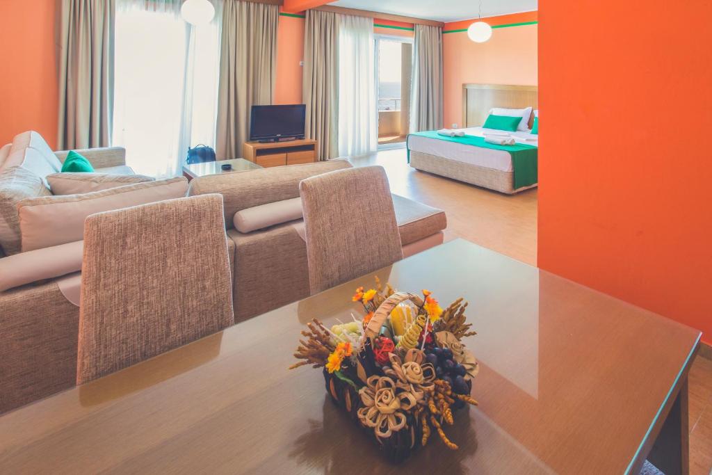 a living room with a couch and a table at Apartments Deus in Dobra Voda
