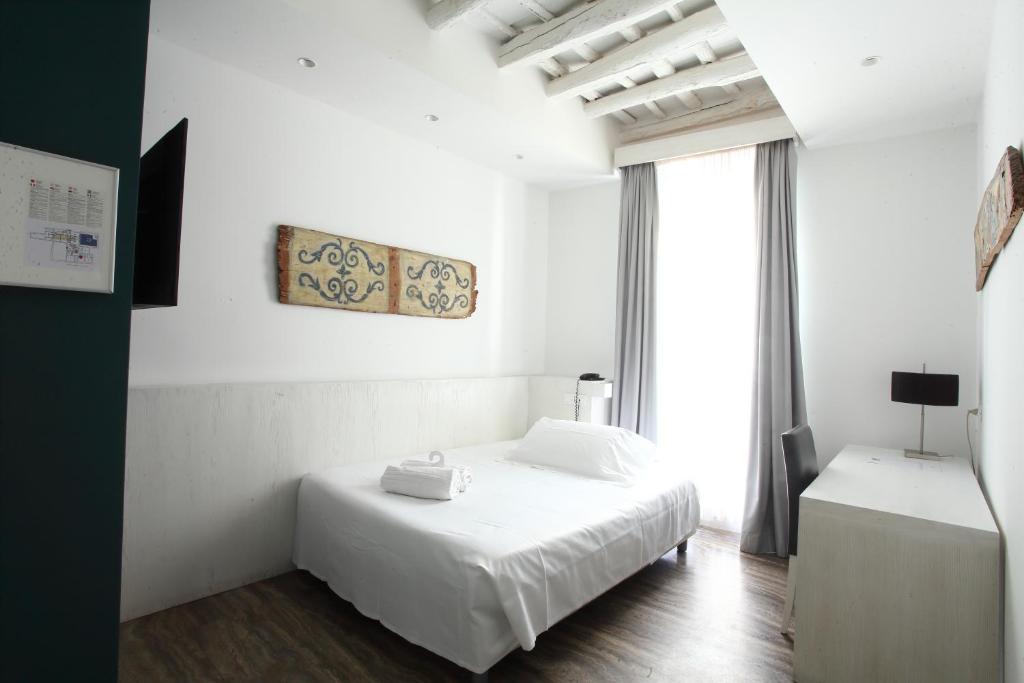 Postel nebo postele na pokoji v ubytování Quintocanto Hotel & Spa