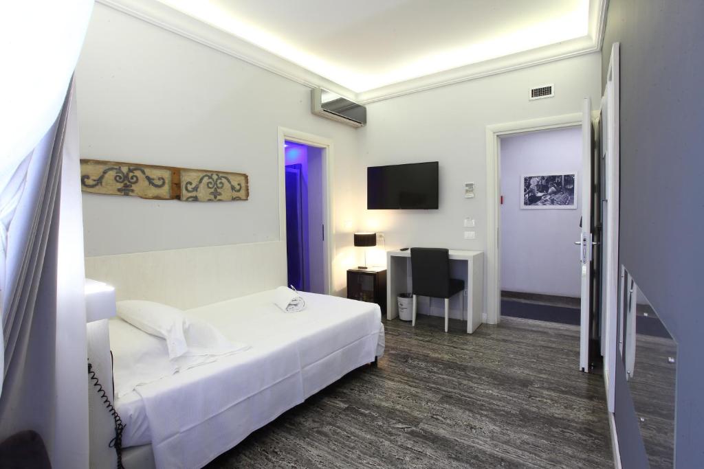 Postel nebo postele na pokoji v ubytování Quintocanto Hotel & Spa