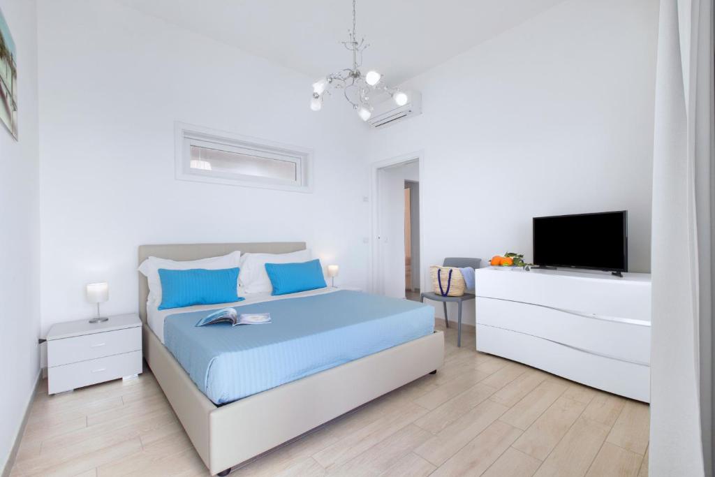 Łóżko lub łóżka w pokoju w obiekcie Amore Rentals - Villa Anna