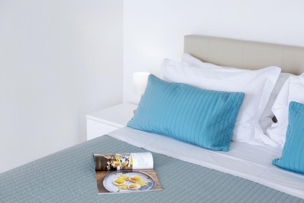 Łóżko lub łóżka w pokoju w obiekcie Amore Rentals - Villa Anna