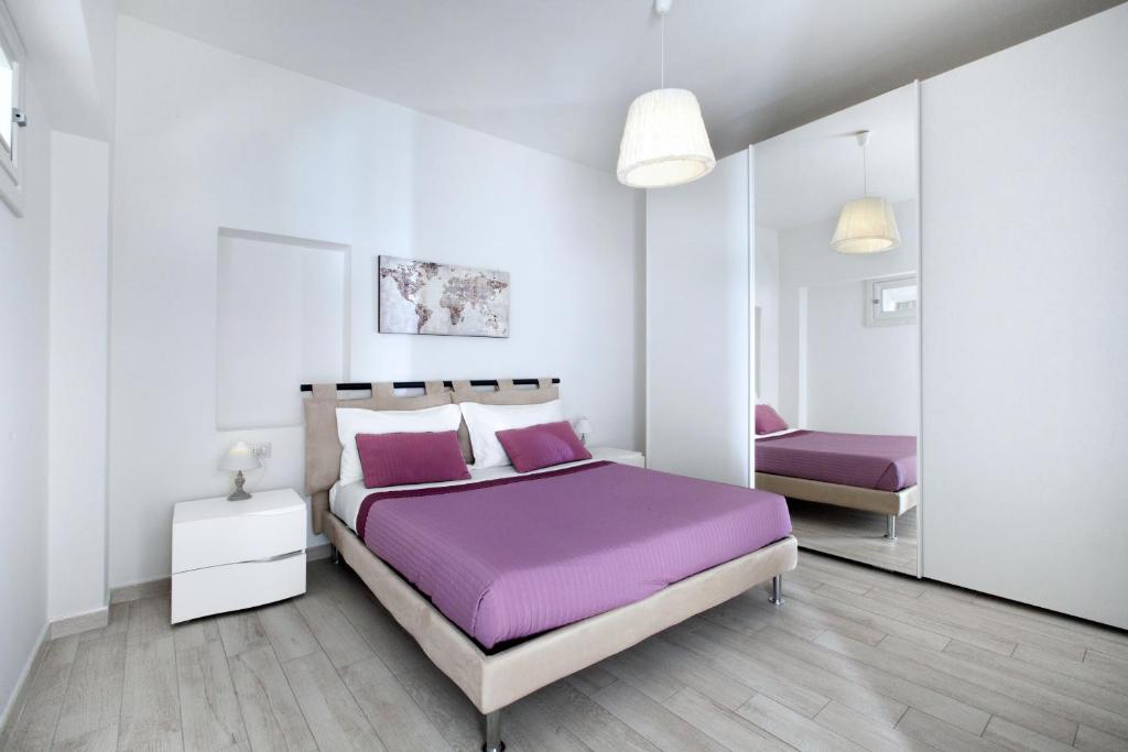 Łóżko lub łóżka w pokoju w obiekcie Amore Rentals - Villa Anna
