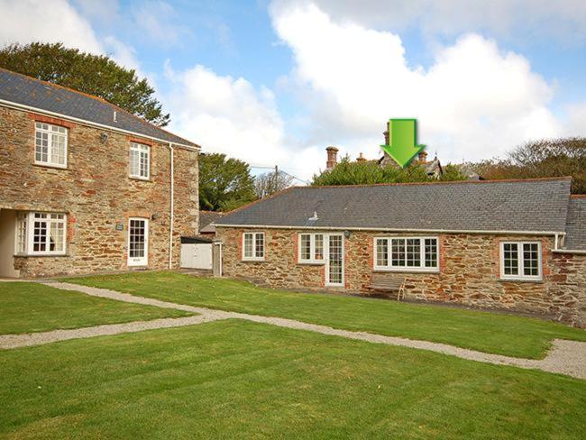 a brick house with a grass yard in front of it at 2 Bed in Perranporth WHHOU in Perranporth