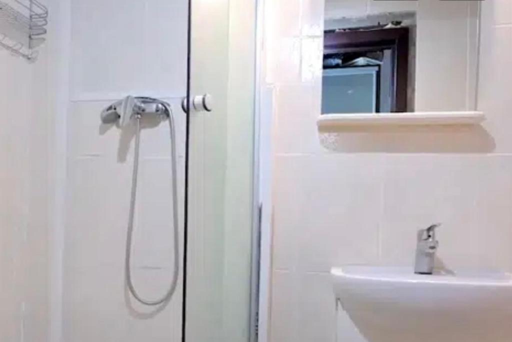 a bathroom with a shower and a sink at VIP apart 680 in Tbilisi City