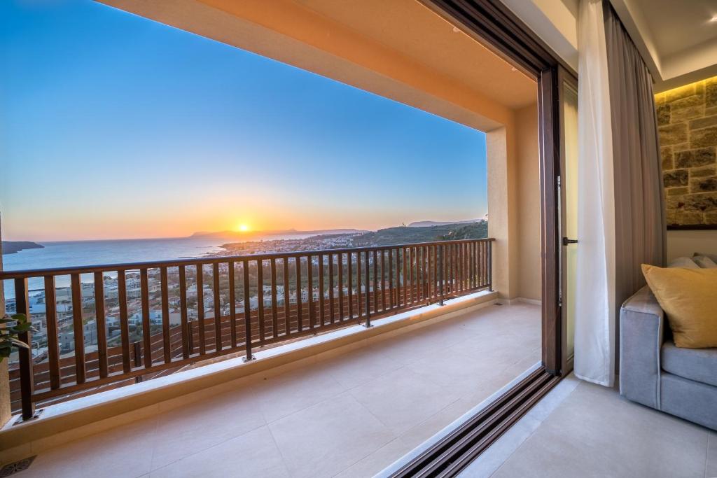 a balcony with a view of the ocean at Golden View Luxury Villa Platanias in Plataniás