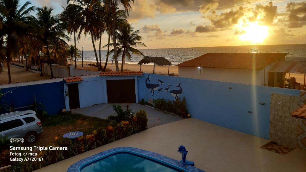 a view of a house with a view of the ocean at Casa beira mar com piscina Coruripe Povoado Miai de cima in Coruripe