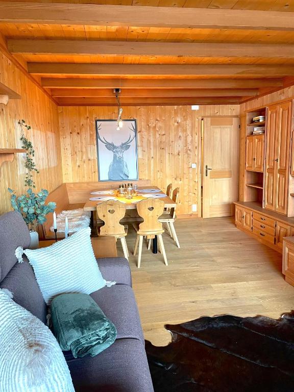 a living room with a couch and a table at Cozy apartment in St. Moritz in St. Moritz