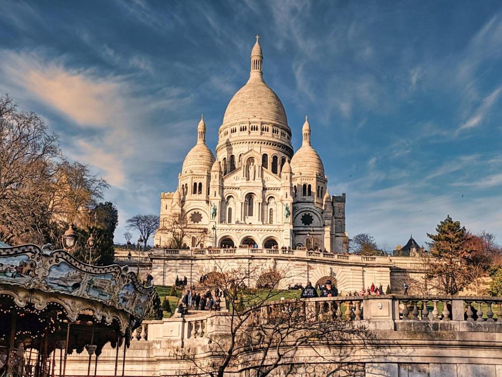 a view of the building of the cathedral of learning at Beautiful family flat nearby the Flea Market, Stade de France, Montmartre in Saint-Ouen