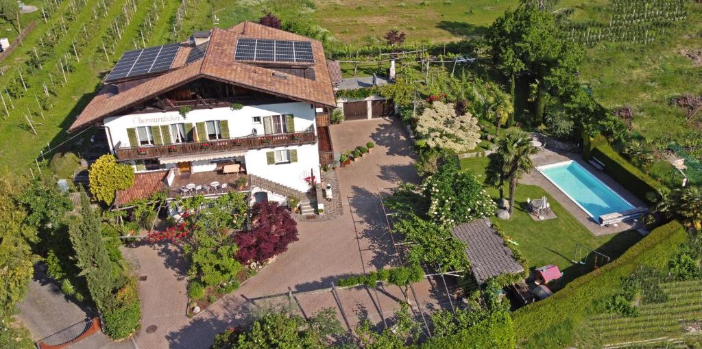 an overhead view of a house with a solar roof at Obermaratscher Apartments Residence in Lagundo