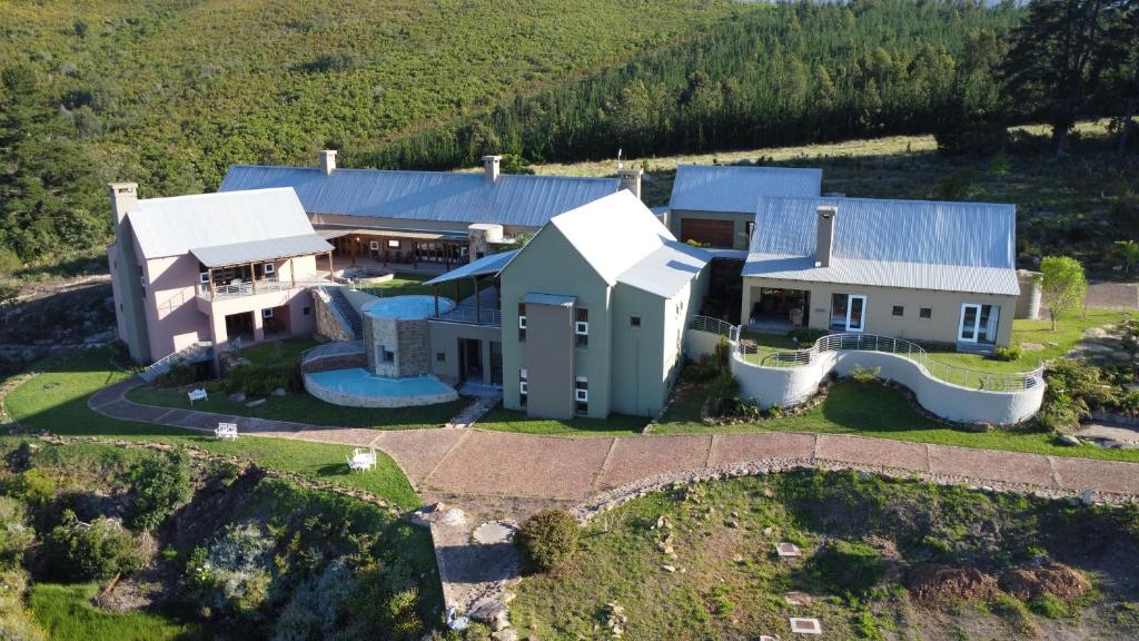 an aerial view of a house on a hill at Segulah Guesthouse in Mossel Bay