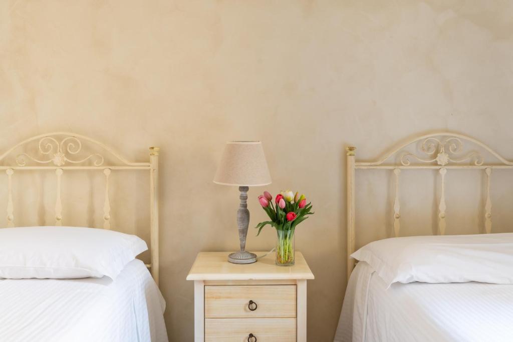Postel nebo postele na pokoji v ubytování Palazzo De Luca by Apulia Hospitality