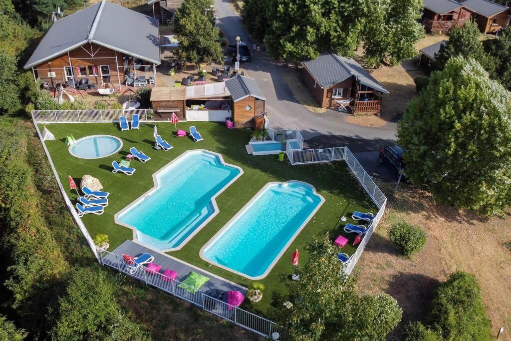 an aerial view of a backyard with two swimming pools at Camping Domaine Vallée du Tarn SN in Saint-Cirgue