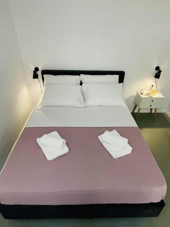Łóżko lub łóżka w pokoju w obiekcie Sabbia Calda Apartments