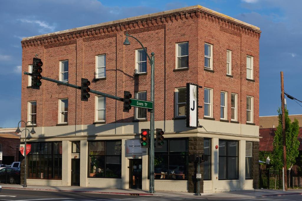 a red brick building with a traffic light on a street at The Jesse Hotel & Bar in Reno