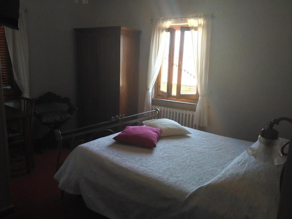 Postel nebo postele na pokoji v ubytování Albergo Villa Sorriso