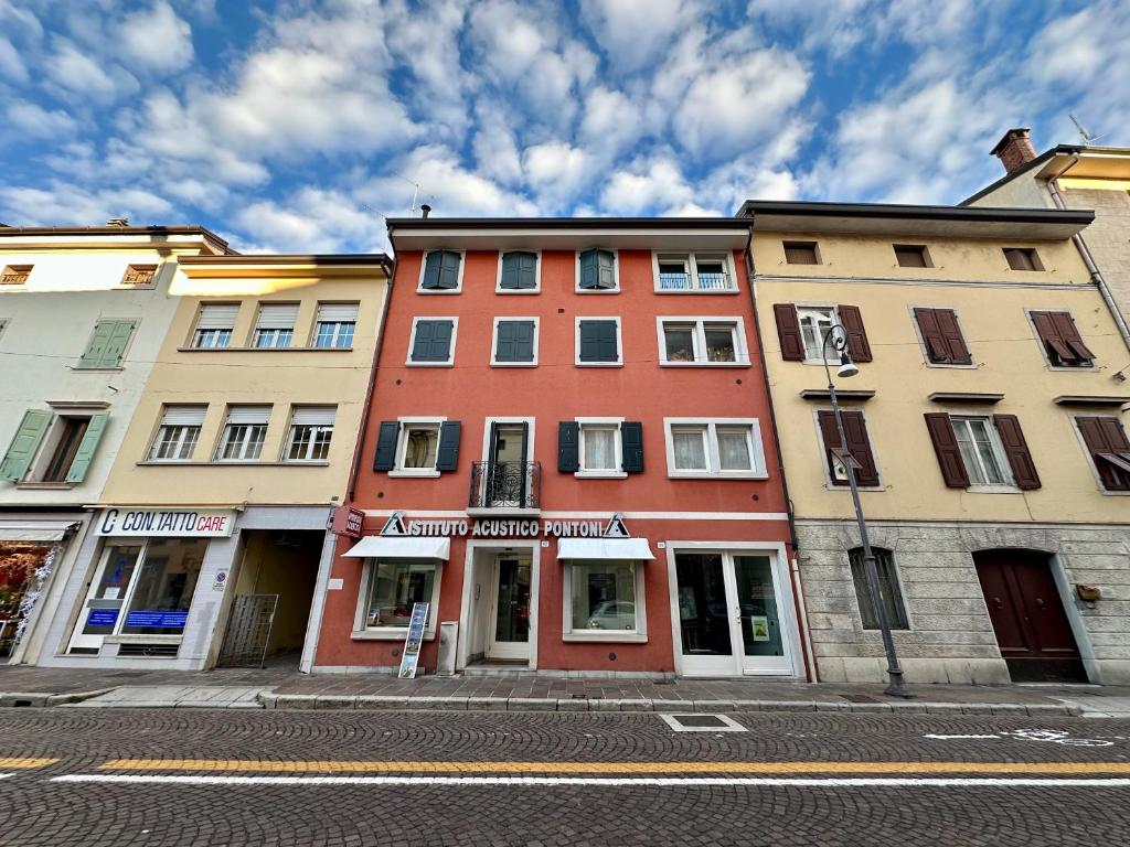 a row of buildings on a city street at Appartamento con terrazzo in Udine