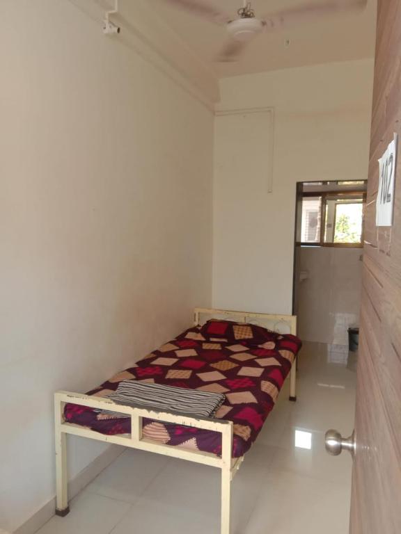 Postel nebo postele na pokoji v ubytování Hemprabha Bed & Breakfast, Ratnagiri