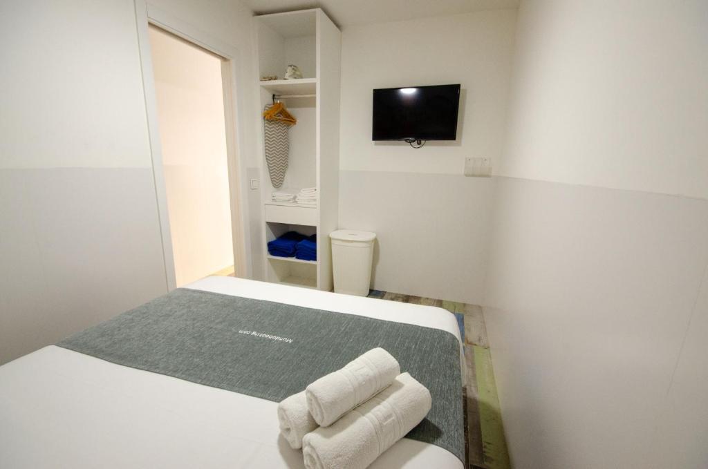Postel nebo postele na pokoji v ubytování AUREA 5-B centro Levante