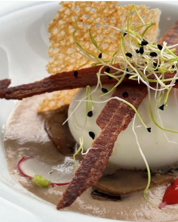 a plate of food with some food on it at Hôtel du Musée in Granville