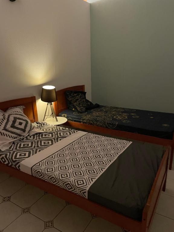 Llit o llits en una habitació de Case colorée