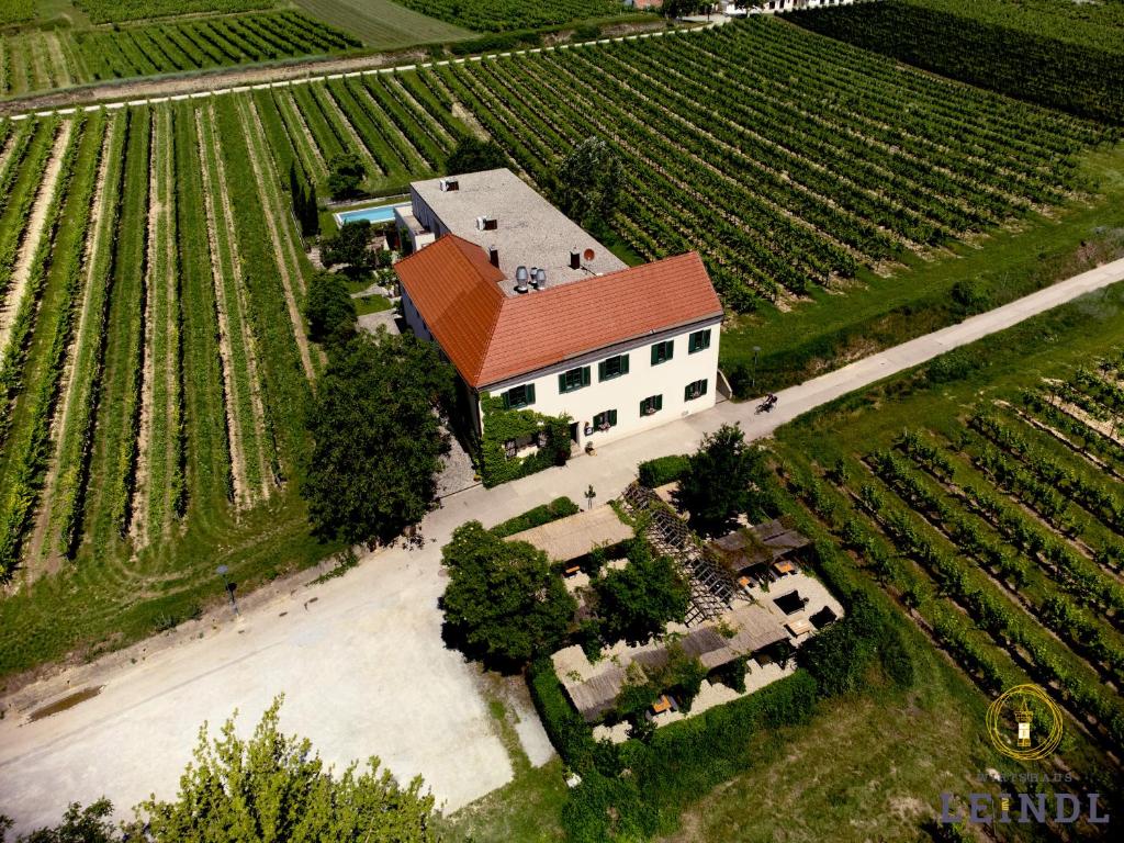 an aerial view of a large white building with a red roof at Wirtshaus Leindl in Krems an der Donau