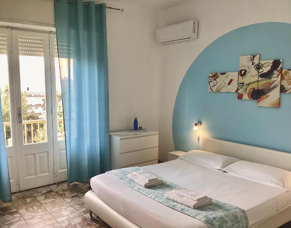 Postel nebo postele na pokoji v ubytování Gardenia Rooms