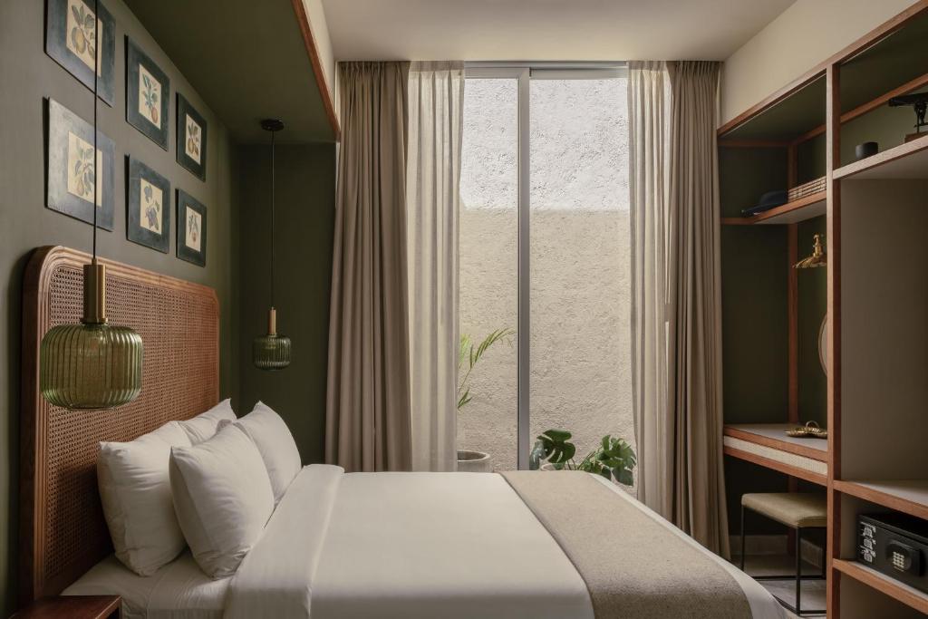 Postel nebo postele na pokoji v ubytování Hotel Sureño Yucatan