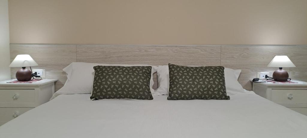 Postel nebo postele na pokoji v ubytování B&B Monastero