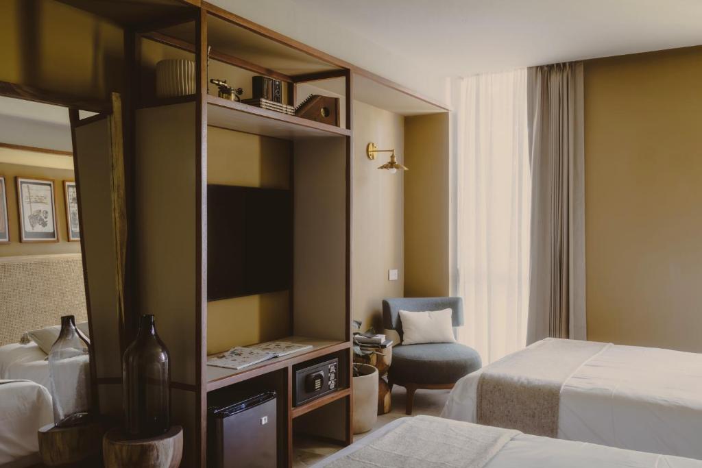 Postel nebo postele na pokoji v ubytování Hotel Sureño Yucatan