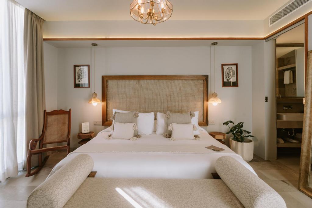 Postel nebo postele na pokoji v ubytování Hotel Sureño Yucatan